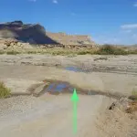 5)0.9 miles, cross Wahweap Creak.  Often has flowing water, but usu- ally not difficult to cross. Camp   spot on the right before the river